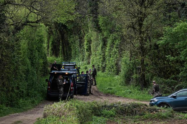 (FILES) French gendarmes take part in search operations aimed at locating the missing 28-year-old jogger Agathe Hilairet in Vivonne, western France, on April 13, 2025. Hilairet's body was found on May 4, 2025 in the woods, local prosecutor's office announced on May 5. "The autopsy carried out today did not allow us to determine, at this stage, the causes of death. Several additional analyses are underway in order to continue the investigations, prosecutor said in a statement. (Photo by Philippe LOPEZ / AFP)
