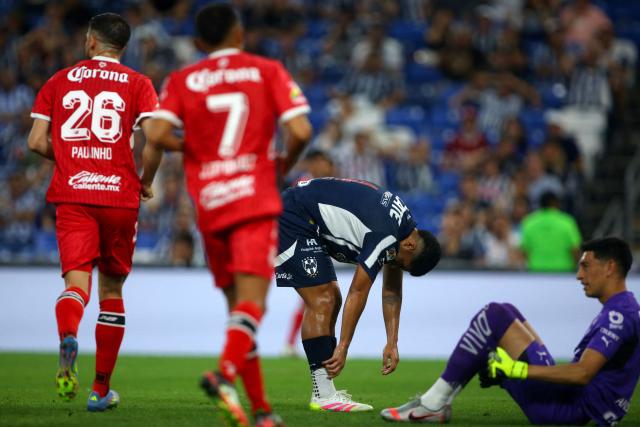 Monterrey's defender #04 Victor Guzman (2nd R) reacts past teammate goalkeeper #01 Esteban Andrada (R) after scoring an own goal during the Liga MX Clausura tournament quarter-final first leg football match between Monterrey and Toluca at the BBVA Stadium in Monterrey, Nuevo Leon state, Mexico, on May 7, 2025. (Photo by Julio Cesar AGUILAR / AFP)