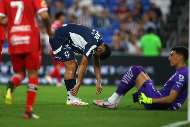 Monterrey's defender #04 Victor Guzman (2nd R) reacts past teammate goalkeeper #01 Esteban Andrada (R) after scoring an own goal during the Liga MX Clausura tournament quarter-final first leg football match between Monterrey and Toluca at the BBVA Stadium in Monterrey, Nuevo Leon state, Mexico, on May 7, 2025. (Photo by Julio Cesar AGUILAR / AFP)