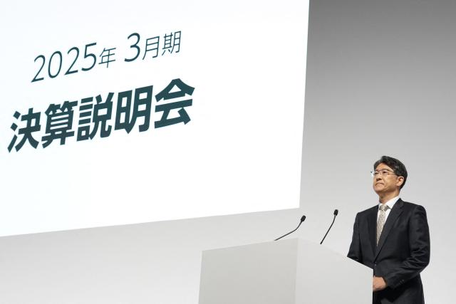 Toyota Motor President and CEO Koji Sato holds a press briefing for the company's financial results in Tokyo on May 8, 2025. Japanese auto giant Toyota forecast a 35 percent year-on-year drop in net profit to 21.6 billion USD for the 2025-26 financial year. (Photo by Kazuhiro NOGI / AFP)