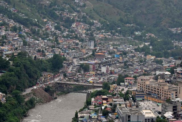 This photograph taken on May 9, 2025 shows the Neelum River flowing through Muzaffarabad, the capital of Pakistan-administered Kashmir. India and Pakistan accused each other on May 8 of carrying out waves of drone attacks, as deadly confrontations between the nuclear-armed foes drew global calls for calm. (Photo by Sajjad QAYYUM / AFP)