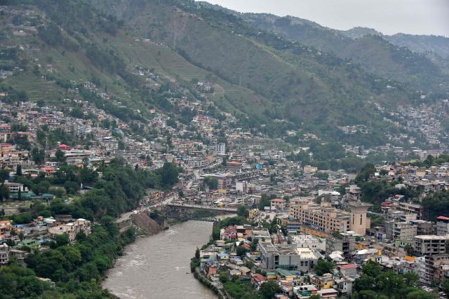 This photograph taken on May 9, 2025 shows the Neelum River flowing through Muzaffarabad, the capital of Pakistan-administered Kashmir. India and Pakistan accused each other on May 8 of carrying out waves of drone attacks, as deadly confrontations between the nuclear-armed foes drew global calls for calm. (Photo by Sajjad QAYYUM / AFP)