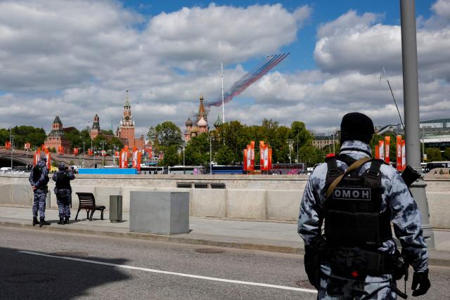 Russian Sukhoi SU-25 fighter jets release smoke in the colours of the Russian tricolor flag as they fly over central Moscow during the Victory Day military parade on May 9, 2025. Russia celebrates the 80th anniversary of the Soviet Union's victory over Nazi Germany in World War Two (WWII). (Photo by TATYANA MAKEYEVA / AFP)