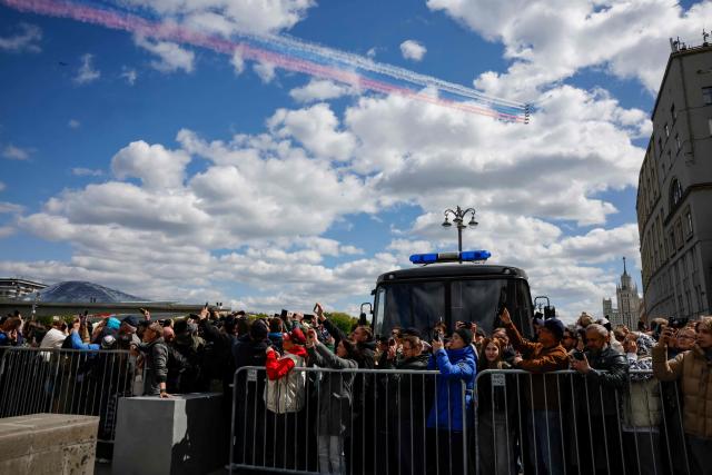 Russian Sukhoi SU-25 fighter jets release smoke in the colours of the Russian tricolor flag as they fly over central Moscow during the Victory Day military parade on May 9, 2025. Russia celebrates the 80th anniversary of the Soviet Union's victory over Nazi Germany in World War Two (WWII). (Photo by TATYANA MAKEYEVA / AFP)