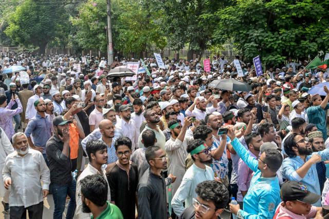 Protesters gather near the State Guest House Jamuna, the official residence of Bangladesh's Chief Advisor Office of Interim Government Muhammad Yunus, demanding a ban on the ousted Sheikh Hasina’s party, the Awami League, in Dhaka on May 9, 2025. (Photo by Munir UZ ZAMAN / AFP)