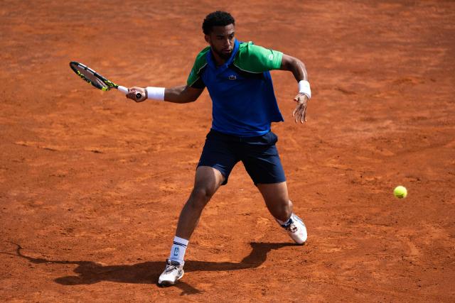 France’s Arthur Fils returns to Netherlands’ Tallon Griekspoor during their match of the ATP Rome Open tennis tournament at Foro Italico in Rome on May 9, 2025. (Photo by MARCO BERTORELLO / AFP)