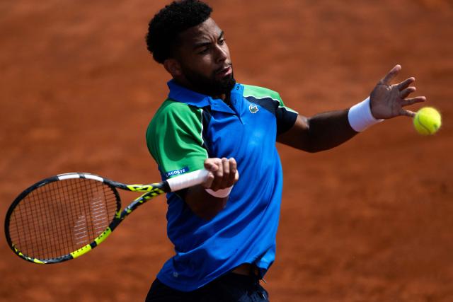 France’s Arthur Fils returns to Netherlands’ Tallon Griekspoor during their match of the ATP Rome Open tennis tournament at Foro Italico in Rome on May 9, 2025. (Photo by MARCO BERTORELLO / AFP)