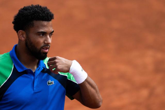 France’s Arthur Fils reacts during his match against Netherlands’ Tallon Griekspoor at the ATP Rome Open tennis tournament at Foro Italico in Rome on May 9, 2025. (Photo by MARCO BERTORELLO / AFP)