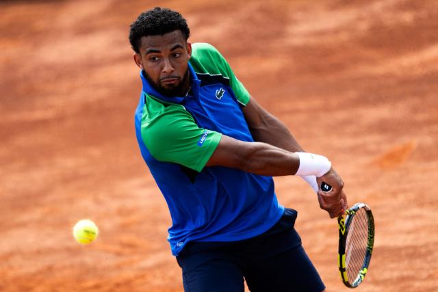 France’s Arthur Fils returns to Netherlands’ Tallon Griekspoor during their match of the ATP Rome Open tennis tournament at Foro Italico in Rome on May 9, 2025. (Photo by MARCO BERTORELLO / AFP)