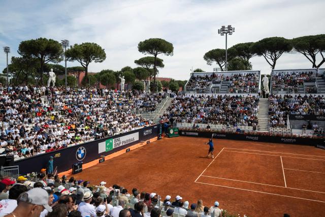 France’s Arthur Fils returns to Netherlands’ Tallon Griekspoor during their match of the ATP Rome Open tennis tournament at Foro Italico in Rome on May 9, 2025. (Photo by MARCO BERTORELLO / AFP)