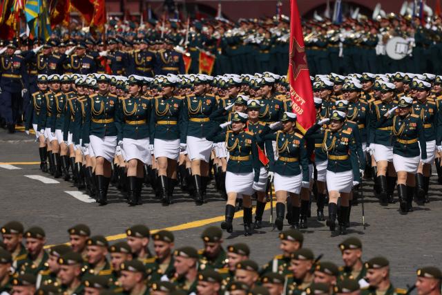 Russian servicewomen march during the Victory Day military parade at Red Square in central Moscow on May 9, 2025. Russia celebrates the 80th anniversary of the Soviet Union's victory over Nazi Germany in World War Two (WWII). (Photo by STRINGER / AFP)