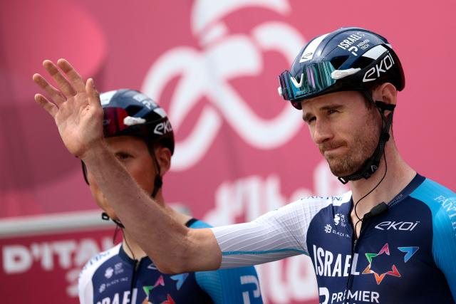 Israel-Premier Tech's Canadian rider Derek Gee waves during the presentation prior to the first stage of the 108th Giro d'Italia cycling race, 160km from Durres to Tirana in Albania, on May 9, 2025. (Photo by Luca Bettini / AFP)