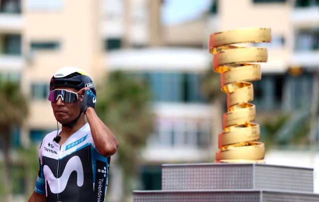 Movistar Team's Colombian rider Nairo Quintana walks past the Giro d'Italia trophy (“trofeo senza fine”) prior to the first stage of the 108th Giro d'Italia cycling race, 160km from Durres to Tirana in Albania, on May 9, 2025. (Photo by Luca Bettini / AFP)