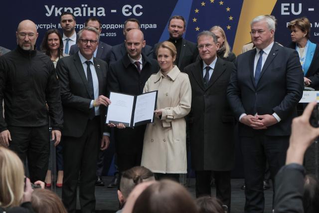 Ukrainian Prime Minister Denys Shmyhal (L) and Ukrainian Minister of Foreign Affairs Andrii Sybiha (R) pose with EU High Representative for Foreign Affairs and Security Policy Kaja Kallas (C-R) and France's Minister for Europe and Foreign Affairs Jean-Noel Barrot (C-L) as they attend a signing ceremony during a Ukraine-EU meeting in Lviv, on May 9, 2025, amid the Russian invasion of Ukraine. The EU on May 9, 2025, pledged to disburse one billion euros ($1.1 billion) from the proceeds of frozen Russian assets to Ukrainian arms companies as part of its support to Kyiv as it fights off Moscow's invasion. (Photo by Sergii VOLSKYI / AFP)