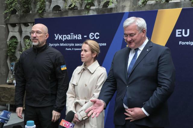 Ukrainian Prime Minister Denys Shmyhal (L), Ukrainian Minister of Foreign Affairs Andrii Sybiha (R) and EU High Representative for Foreign Affairs and Security Policy Kaja Kallas speak to the press during a Ukraine-EU meeting in Lviv, on May 9, 2025, amid the Russian invasion of Ukraine. The EU on May 9, 2025, pledged to disburse one billion euros ($1.1 billion) from the proceeds of frozen Russian assets to Ukrainian arms companies as part of its support to Kyiv as it fights off Moscow's invasion. (Photo by Sergii VOLSKYI / AFP)