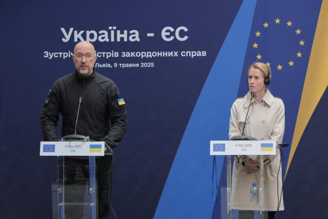 Ukrainian Prime Minister Denys Shmyhal (L) speaks next to EU High Representative for Foreign Affairs and Security Policy Kaja Kallas during a Ukraine-EU meeting in Lviv, on May 9, 2025, amid the Russian invasion of Ukraine. The EU on May 9, 2025, pledged to disburse one billion euros ($1.1 billion) from the proceeds of frozen Russian assets to Ukrainian arms companies as part of its support to Kyiv as it fights off Moscow's invasion. (Photo by Sergii VOLSKYI / AFP)