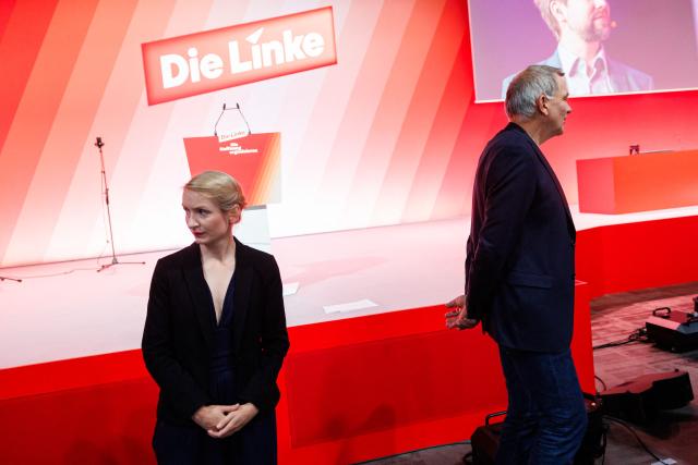 Ines Schwerdtner, co-leader of Germany's The Left (Die Linke) party, and Jan van Aken, co-leader of Germany's The Left (Die Linke) party are pictured prior to the start of the federal party congress in Chemnitz, eastern Germany on May 9, 2025. (Photo by JENS SCHLUETER / AFP)