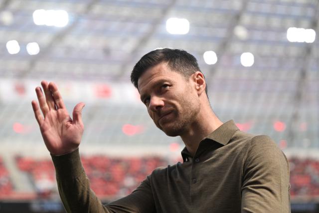 (FILES) Bayer Leverkusen's Spanish head coach Xabi Alonso waves prior to the German first division Bundesliga football match between Bayer 04 Leverkusen and FC Augsburg in Leverkusen, western Germany on April 26, 2025. Bayer Leverkusen coach Xabi Alonso confirmed on May 9, 2025 he will leave the club at the end of the season, amid reports linking him to Spanish giants Real Madrid. (Photo by INA FASSBENDER / AFP) / DFL REGULATIONS PROHIBIT ANY USE OF PHOTOGRAPHS AS IMAGE SEQUENCES AND/OR QUASI-VIDEO