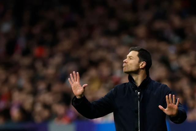 (FILES) Bayer Leverkusen's Spanish coach Xabi Alonso gestures during the UEFA Champions League, league phase football match between Club Atletico de Madrid and Bayer Leverkusen at the Metropolitano stadium in Madrid on January 21, 2025. Bayer Leverkusen coach Xabi Alonso confirmed on May 9, 2025 he will leave the club at the end of the season, amid reports linking him to Spanish giants Real Madrid. (Photo by OSCAR DEL POZO / AFP)