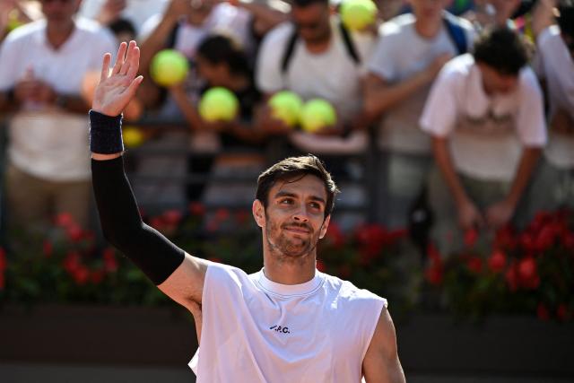 Italy's Lorenzo Musetti celebrates after winning against Finland's Otto Virtanen at the end of their match of the ATP Rome Open tennis tournament at Foro Italico in Rome on May 9, 2025. (Photo by PIERO CRUCIATTI / AFP)