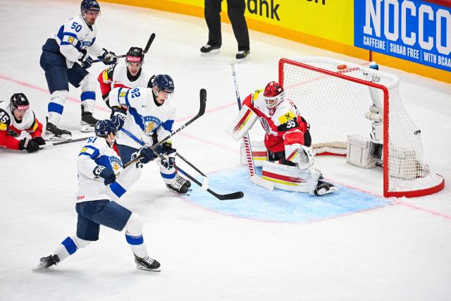Finland’s forward #61 Juuso Parssinen shoots to score 0-2 past Austria’s goaltender #35 Atte Tolvanen during the IIHF Men's Ice Hockey World Championship match between Austria and Finland in Stockholm, on May 9, 2025. (Photo by Jonathan NACKSTRAND / AFP)