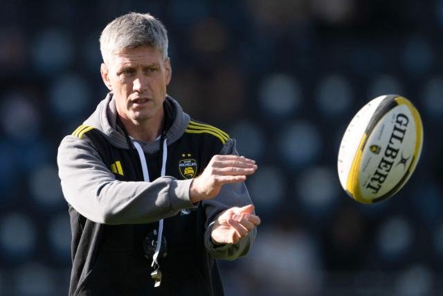 (FILES) La Rochelle's Irish coach Ronan O'Gara throws the ball during a training session prior to  the French Top14 rugby union match between Stade Rochelais (La Rochelle) and Racing 92 at the Marcel-Deflandre Stadium in La Rochelle, western France on February 22, 2025. The La Rochelle head coach has been suspended for five weeks for "actions against a match official" the French Rugby Federation announced on May 9, 2025 for his behaviour during his team's 45-26 Top 14 defeat to Toulon at the end of January 2025. (Photo by XAVIER LEOTY / AFP)