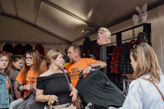 Bikers walk through aisles of stands during the Harley-Davidson Euro 2025 Festival near Grimaud, southern France, on May 9, 2025. (Photo by Frederic DIDES / AFP)