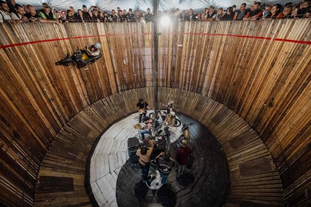 A biker rides the "Wall of death" attraction during the Harley-Davidson Euro 2025 Festival near Grimaud, southern France, on May 9, 2025. (Photo by Frederic DIDES / AFP)