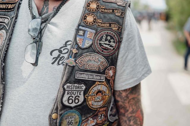 This photograph shows a biker wearing a Harley-Davidson leather jacket during the Harley-Davidson Euro 2025 Festival near Grimaud, southern France, on May 9, 2025. (Photo by Frederic DIDES / AFP)