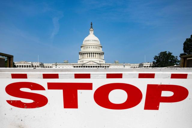 (FILES) A barrier to stop vehicles stands in front of the US Capitol in Washington, DC, on May 11, 2023. There is a "reasonable probability" the US will hit its borrowing limit in August when Congress is in recess, US Secretary of Treasury Scott Bessent said on May 9, 2025, calling on lawmakers to act. "I respectfully urge Congress to increase or suspend the debt limit by mid-July, before its scheduled break, to protect the full faith and credit of the United States," he wrote in a letter to US Speaker of the House Mike Johnson. (Photo by Jim WATSON / AFP)