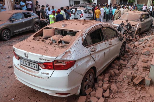 Damaged vehicles are pictured following Pakistani artillery shelling in Jammu on May 10, 2025. The Indian army on May 10 reported fresh Pakistani attacks along the border with its arch-foe as the conflict between the nuclear-armed neighbours spiralled. (Photo by Rakesh BAKSHI / AFP)