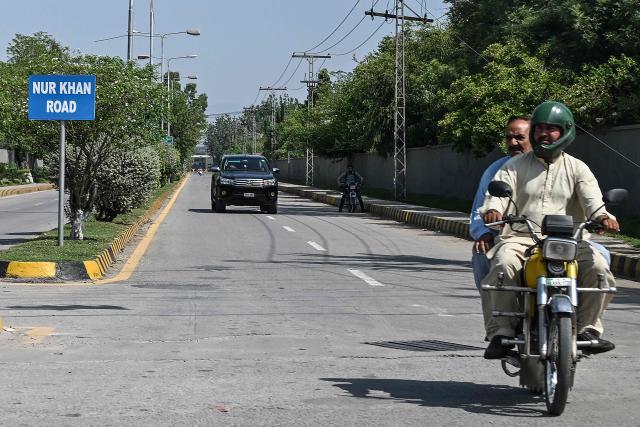 Commuters drive through a street in the cantonment area near Nur Khan air base after Indian strikes, in Rawalpindi, on May 10, 2025. Pakistan on May 10 launched counterattacks against India after three of its air bases were struck overnight, as the conflict between the nuclear-armed neighbours spiralled toward full-blown war. (Photo by Aamir QURESHI / AFP)