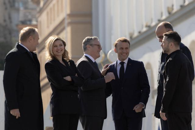 (From L) Poland's Prime Minister Donald Tusk, Olena Zelenska, Britain's Prime Minister Keir Starmer, France's President Emmanuel Macron, Ukraine's President Volodymyr Zelensky  and Germany's Chancellor Friedrich Merz visit the Independence Square (Maidan) in Kyiv on May 10, 2025, ahead of a gathering of European leaders in the Ukranian capital. The leaders of Britain, France, Germany and Poland make an unprecedented joint visit to Kyiv on May 10, 2025 for talks with Ukraine's President Volodymyr and to urge Russia to agree a ceasefire, a joint statement said. (Photo by Roman PILIPEY / AFP)