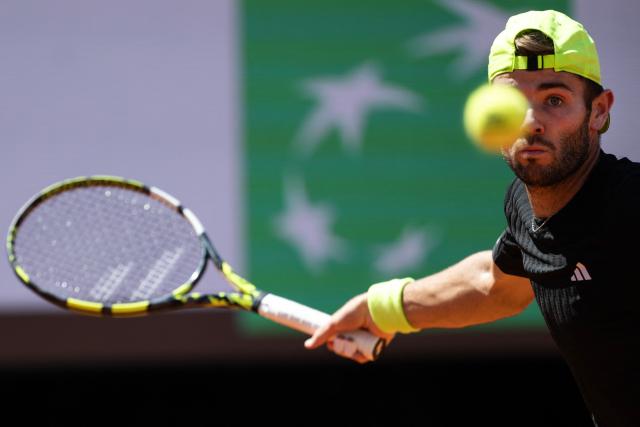 Britain’s Jacob Fearnley plays a forehand return to Italy’s Matteo Berrettini during their men's singles match for the ATP Rome Open tennis tournament at Foro Italico in Rome on May 10, 2025. (Photo by MARCO BERTORELLO / AFP)