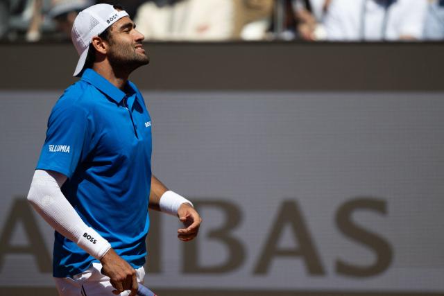 Italy’s Matteo Berrettini reacts during the men's singles match against Britain’s Jacob Fearnley at the ATP Rome Open tennis tournament at Foro Italico in Rome on May 10, 2025.  (Photo by MARCO BERTORELLO / AFP)