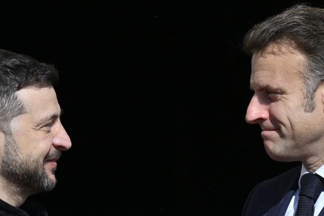 Ukraine's President Volodymyr Zelensky (L) welcomes France's President Emmanuel Macron before a gathering of European leaders in the Ukrainian capital Kyiv on May 10, 2025, amid the Russian invasion of Ukraine. The leaders of Britain, France, Germany and Poland make an unprecedented joint visit to Kyiv on May 10, 2025 for talks with Ukraine's President Volodymyr and to urge Russia to agree a ceasefire, a joint statement said. (Photo by Genya SAVILOV / AFP)