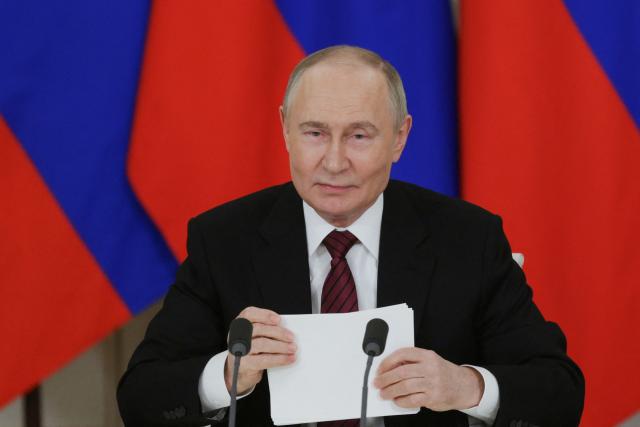 In this pool photograph distributed by Russian state agency Sputnik, Russia's President Vladimir Putin addresses the media following his meetings with foreign leaders in Moscow on May 11, 2025, during celebrations of the 80th anniversary of the Soviet Union's victory over Nazi Germany in World War II. (Photo by Gavriil GRIGOROV / POOL / AFP)
