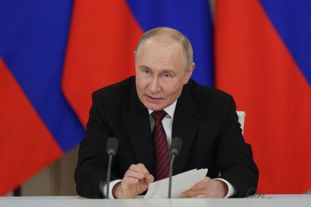 In this pool photograph distributed by Russian state agency Sputnik, Russia's President Vladimir Putin addresses the media following his meetings with foreign leaders in Moscow on May 11, 2025, during celebrations of the 80th anniversary of the Soviet Union's victory over Nazi Germany in World War II. (Photo by Gavriil GRIGOROV / POOL / AFP)