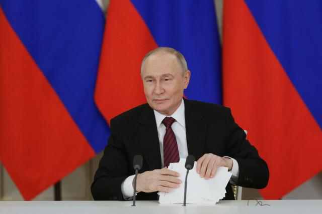 In this pool photograph distributed by Russian state agency Sputnik, Russia's President Vladimir Putin addresses the media following his meetings with foreign leaders in Moscow on May 11, 2025, during celebrations of the 80th anniversary of the Soviet Union's victory over Nazi Germany in World War II. (Photo by Gavriil GRIGOROV / POOL / AFP)