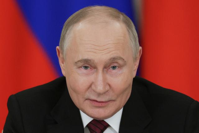 In this pool photograph distributed by Russian state agency Sputnik, Russia's President Vladimir Putin addresses the media following his meetings with foreign leaders in Moscow on May 11, 2025, during celebrations of the 80th anniversary of the Soviet Union's victory over Nazi Germany in World War II. (Photo by Gavriil GRIGOROV / POOL / AFP)