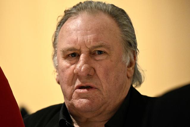 (FILES) French actor Gerard Depardieu arrives on the fourth day of his trial in which he is charged with sexually assaulting two women during a film shoot in 2021, at the Paris criminal court in the Tribunal de Paris courthouse, on March 27, 2025. French actor Gerard Depardieu, tried for the sexual assault against two women, will recieve a judgement at the Batignolles Judicial Court, in Paris on May 13, 2025. (Photo by JULIEN DE ROSA / AFP)