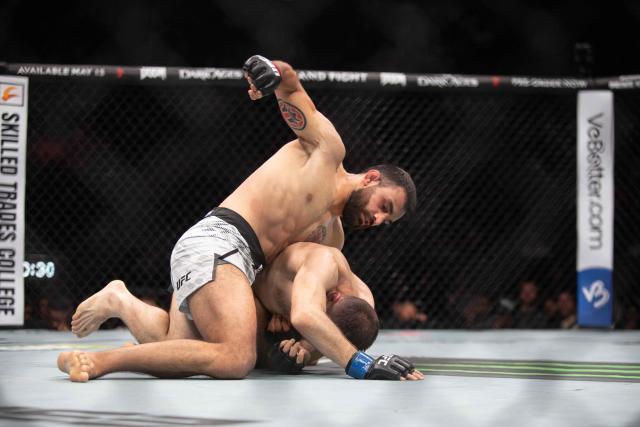 French mixed martial artist Benoit Saint Denis (L) fights against Canada´s mixed martial artist Kyle Prepolec during their lightweight bout at the Ultimate Fighting Championship (UFC) 315 event at Bell Centre in Montreal, Quebec, Canada, May 10, 2025. (Photo by Alexis Aubin / AFP)