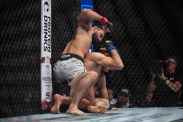 French mixed martial artist Benoit Saint Denis (L) fights against Canada´s mixed martial artist Kyle Prepolec during their lightweight bout at the Ultimate Fighting Championship (UFC) 315 event at Bell Centre in Montreal, Quebec, Canada, May 10, 2025. (Photo by Alexis Aubin / AFP)