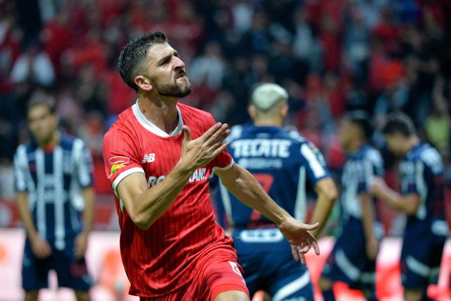 TOPSHOT - Toluca's Portuguese forward #26 Paulinho celebrates after scoring his team's second goal during the Liga MX Clausura tournament quarter-final second leg football match between Toluca and Monterrey at the Nemesio Diez Stadium in Toluca de Lerdo, State of Mexico, Mexico on May 10, 2025. (Photo by Mario Vazquez / AFP)