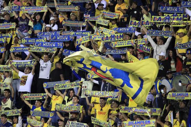 Fans of America cheer for their team ahead of the Liga MX Clausura tournament quarter-final second leg football match between America and Pachuca at the Sports City Stadium in Mexico City on May 10, 2025. (Photo by Victor Cruz / AFP)