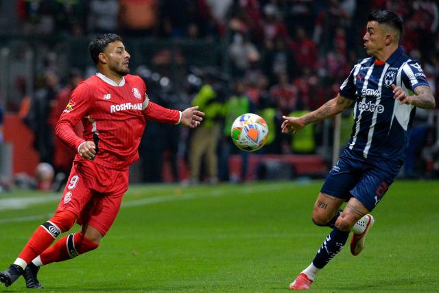 Toluca's forward #09 Alexis Vega and Monterrey's defender #21 Luis Reyes fight for the ball during the Liga MX Clausura tournament quarter-final second leg football match between Toluca and Monterrey at the Nemesio Diez Stadium in Toluca de Lerdo, State of Mexico, Mexico on May 10, 2025. (Photo by Mario Vazquez / AFP)