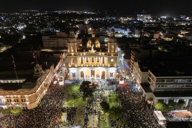 TOPSHOT - This aerial view shows people attending to a mass in honour of newly elected Pope Leo XIV at the Cathedral of Saint Mary in Chiclayo, Peru on May 10, 2025. US' Robert Francis Prevost, who became a Peruvian national in 2015, was elected pope on May 8, 2025, picking the papal name Leo XIV. The US-born pontiff was bishop of Chiclayo from 2015 to 2023, when he was made a cardinal and moved to Rome. (Photo by Ernesto BENAVIDES / AFP)