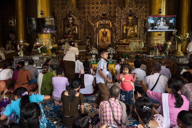 Devotees visit Shwedagon Pagoda to mark Buddha's Birthday, which falls on the Full Moon Day of Kasone, in Yangon on May 11, 2025. (Photo by Sai Aung MAIN / AFP)