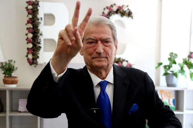Chairman of the Democratic Party of Albania Sali Berisha gestuers after casting his vote at a voting station in Tirana on May 11, 2025, during Albania's parliamentary election. Albanians head to the polls on May 11 to decide whether to give Prime Minister Edi Rama a fourth term or side with his longstanding rival in an election seen as crucial for the country's European Union ambitions. (Photo by STRINGER / AFP)