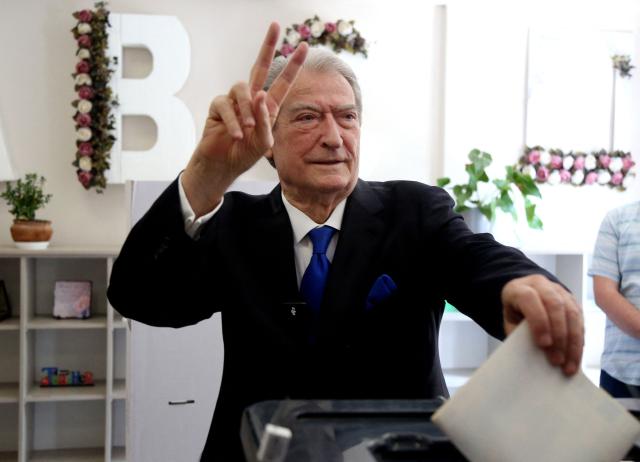Chairman of the Democratic Party of Albania Sali Berisha casts his vote at a voting station in Tirana on May 11, 2025, during Albania's parliamentary election. Albanians head to the polls on May 11 to decide whether to give Prime Minister Edi Rama a fourth term or side with his longstanding rival in an election seen as crucial for the country's European Union ambitions. (Photo by STRINGER / AFP)